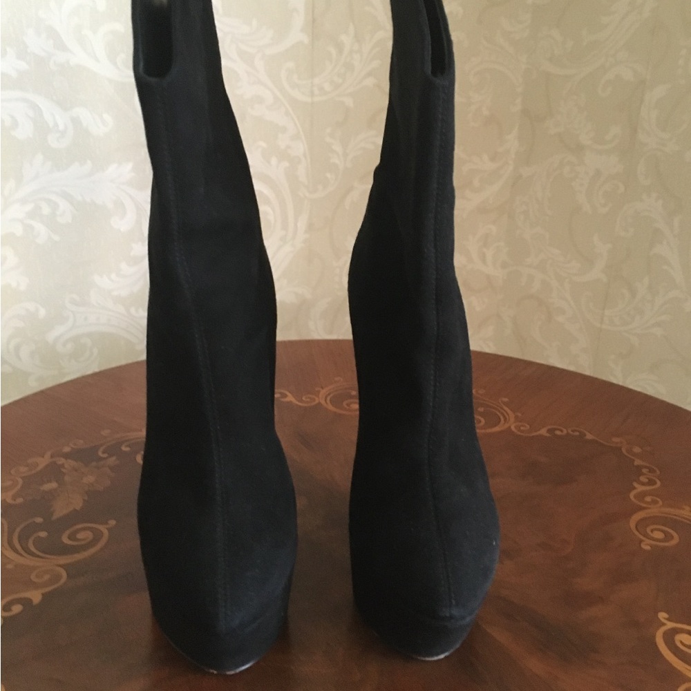 Giuseppe Zanotti women’s platform ankle boots.